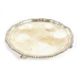 ROBERTS & BELK; a large Elizabeth II hallmarked silver salver with gadrooned piecrust rim on four