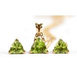 A yellow metal peridot suite of jewellery comprising pendant on chain and earrings, stamped 375,