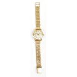 OMEGA; a 9ct yellow gold lady's wristwatch, the silvered dial set with Roman numerals, diameter