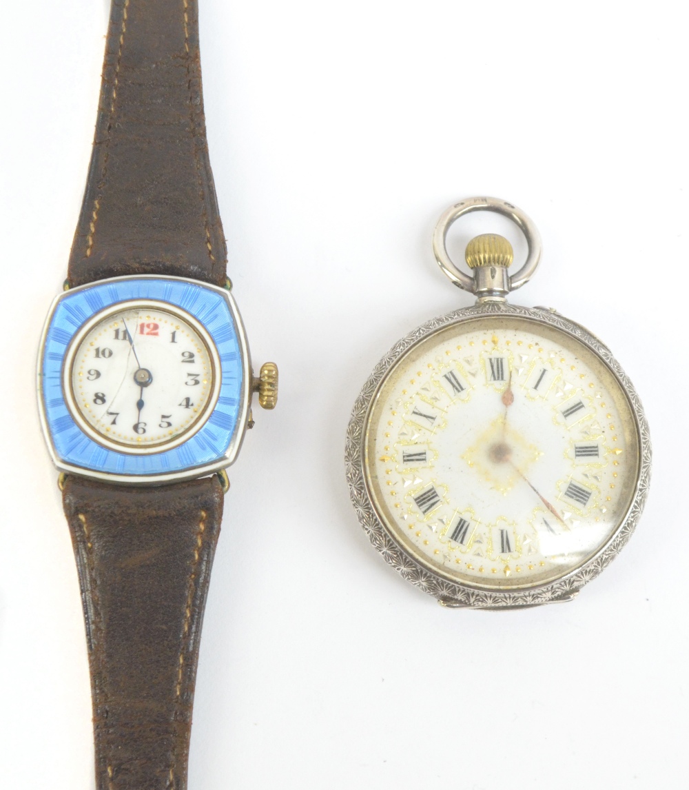 A 1930s gold plated lady's wristwatch with blue guilloche decorated frame and white enamel dial