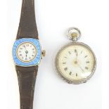 A 1930s gold plated lady's wristwatch with blue guilloche decorated frame and white enamel dial