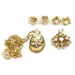 A small group of jewellery including a 9ct yellow gold mounted floral cameo, a 9ct yellow gold