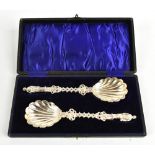 ROBERT STEBBINGS; a pair of Victorian hallmarked silver apostle spoons with shell shaped bowls and