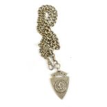 A double Albert silver watch chain with shield shaped fob centred with a cyclist, approx 2.63ozt/