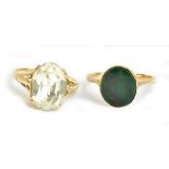 A 9ct yellow gold and oval bloodstone set ring, size M, and a 9ct yellow gold dress ring, size M 1/