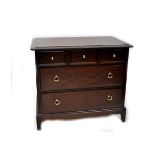 A Stag Minstrel chest of drawers, three frieze drawers over two larger drawers, to bracket support,