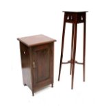 A mahogany bedside cabinet, panelled door to turned supports and a mahogany plant stand (2).