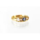 An Edwardian 18ct yellow gold ladies' dress ring set with central sapphire and small diamond to