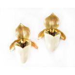 A pair of Royal Worcester ivory and gilt-heightened wall pockets, exotic leaf decoration to the top,