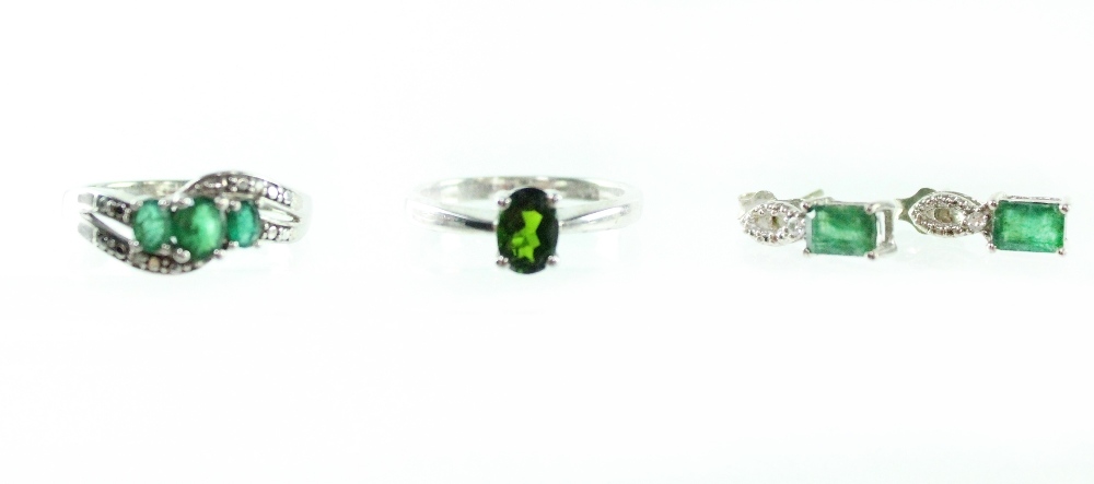 A silver ring set with green stone, a pair of earrings and cluster ring set with green stones (3).