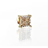 A gentlemen's 9ct gold four small diamond illusion-set earring, size of square mount 7 x 7mm.