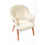 A retro Toothill Wingate tub chair to tapering supports.