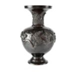A small Japanese lacquered bronze baluster vase decorated with birds and foliage,