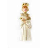 A Royal Worcester candle snuffer in the form of a Regency lady, ivory ground and gilt-heightened,