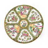 A late 19th/early 20th century Chinese Canton charger with figural and floral panels in the Famille