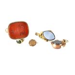 Two 10ct rose gold fobs, each set with semiprecious hardstone,