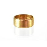 A gentlemen's 9ct gold band ring with chamfered edges, size U, approx 7.3g.