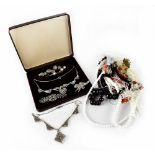 A quantity of costume jewellery to include bead necklaces, white metal and diamanté brooches,