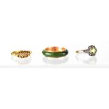 Three fashion rings including a green jade with gold sleeve marked K12,