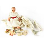 A Victorian wax doll with Christening-style robe, length approx 40cm (af).