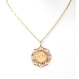 A George V sovereign 1914 in 9ct pendant mount on a 9ct gold necklace chain, combined approx 16g.