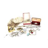 A quantity of costume jewellery to include a beaded bag, ladies' watches, marcasite brooches,