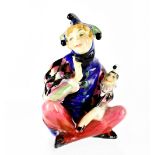 A Royal Doulton figure HN1284 'Lady Jester Sitting', registration no.737564, height 10cm.