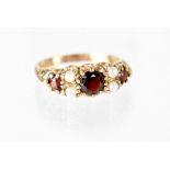 A Victorian ruby and seed pearl ring set in 9ct gold, size P, approx 2.9g.