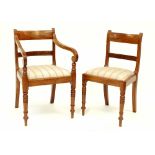 Four Regency bar-back dining chairs with drop-in seats upholstered in striped blue fabric,