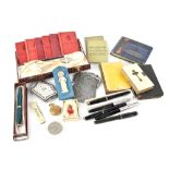 A collectors' lot to include a selection of Parker pens,