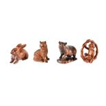 Four 20th century carved boxwood figures including pig, monkey in a bamboo hoop, cat and a rabbit,