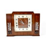 An Art Deco mahogany-cased chiming mantel clock,
