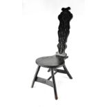 A mid-19th century ebonised spinning chair,