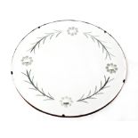 A vintage circular wall mirror with floral decoration, diameter 50cm.