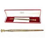 A boxed Elizabeth II hallmarked silver letter opener with Prince of Wales feather finial,