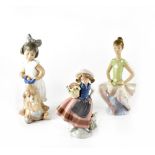 Three Lladró figures, a seated ballerina,