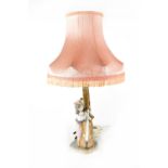 A Nao figural table lamp of a young girl playing the cello,