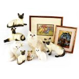 A Louis Wain framed postcard and a print and Beswick porcelain cats including four Siamese,