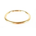 A 9ct gold bangle, diameter 8cm, stamped 9ct, approx 15g, boxed.