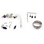 A quantity of silver jewellery to include a bangle, four pairs of earrings, a single earring,