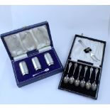 A cased set of three George V hallmarked silver cruets of cylindrical form, London 1932,