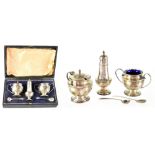 A hallmarked silver cruet set with blue glass liners, marks rubbed, approx 2.2ozt.