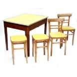 A vintage kitchen dining set comprising a pine-framed table with yellow Formica covered hinged lid