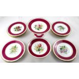 A 19th century porcelain part dessert service with painted rose motifs within gilt and maroon