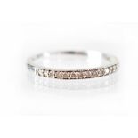 A 9ct white gold ring, marked 375, set with chip diamonds, size X, approx 0.5g.