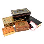 A quantity of tins and boxes to include a marquetry inlaid backgammon board, a vintage tin moneybox,
