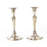 A pair of George V hallmarked silver loaded candlesticks, Goldsmiths & Silversmiths Co Ltd,