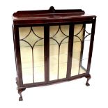 A mahogany two-door display cabinet with central glazed panel,