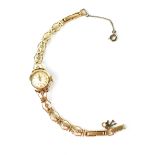 A ladies' vintage Accurist 9ct gold wristwatch on a 9ct gold floral pierced strap, crown wind,