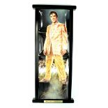 An Elvis Presley The Bradford Exchange limited edition four-plate set depicting Elvis in a golden